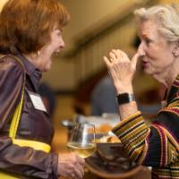 Two women in conversation at event